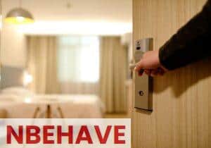 Person Holding on Door Lever Inside Room