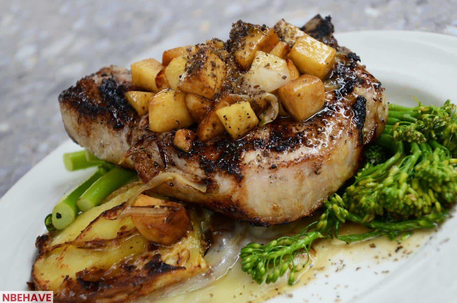 grilled steak with vegetables on white ceramic plate